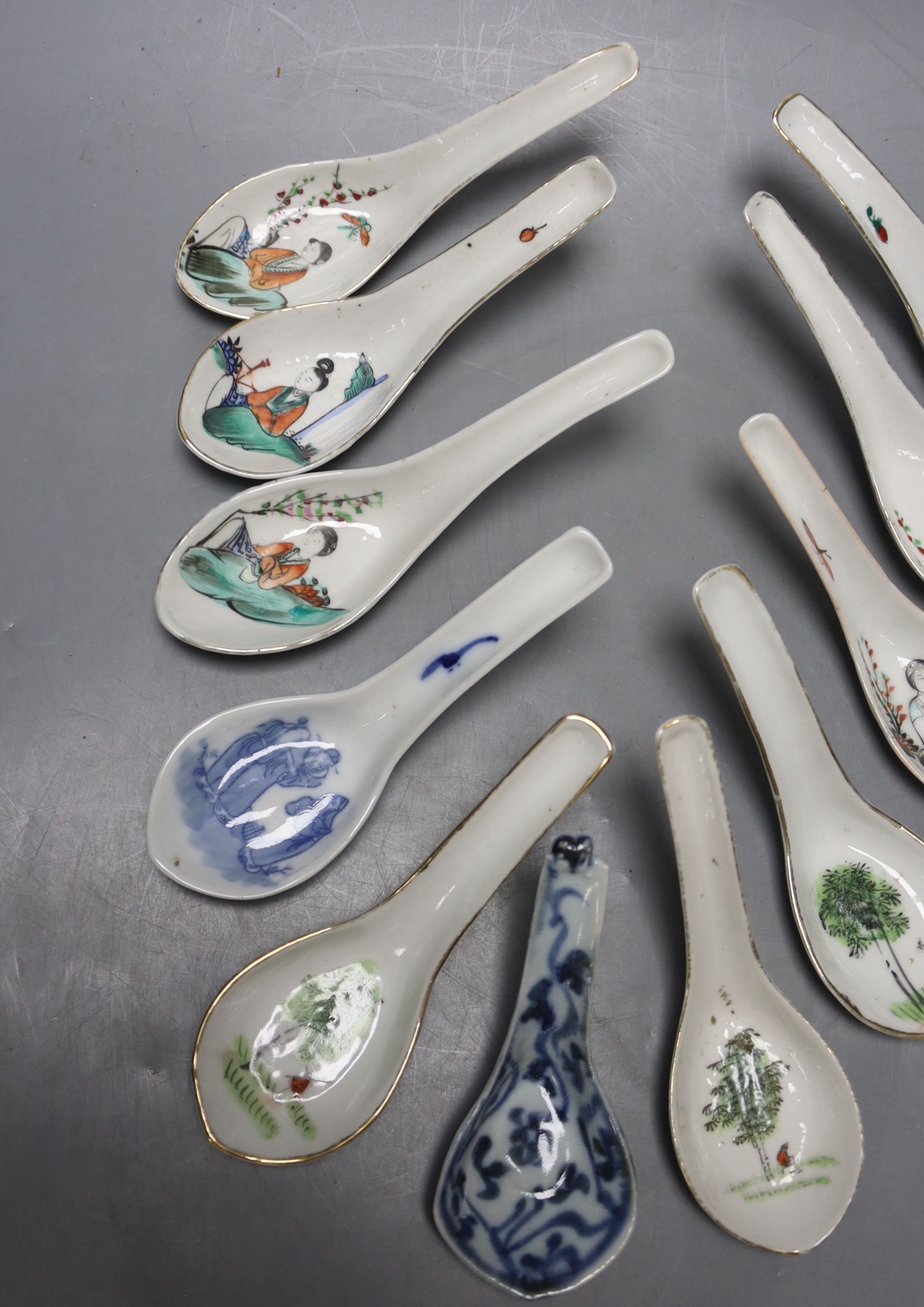 Eleven Chinese porcelain rice spoons, largest 15 cms long.